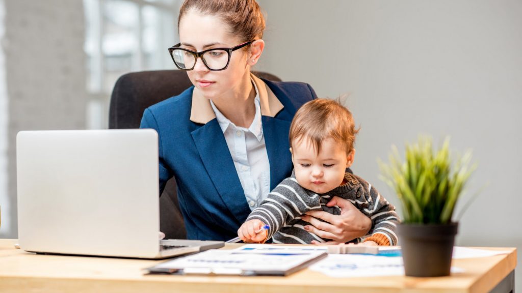 Woman with child at work