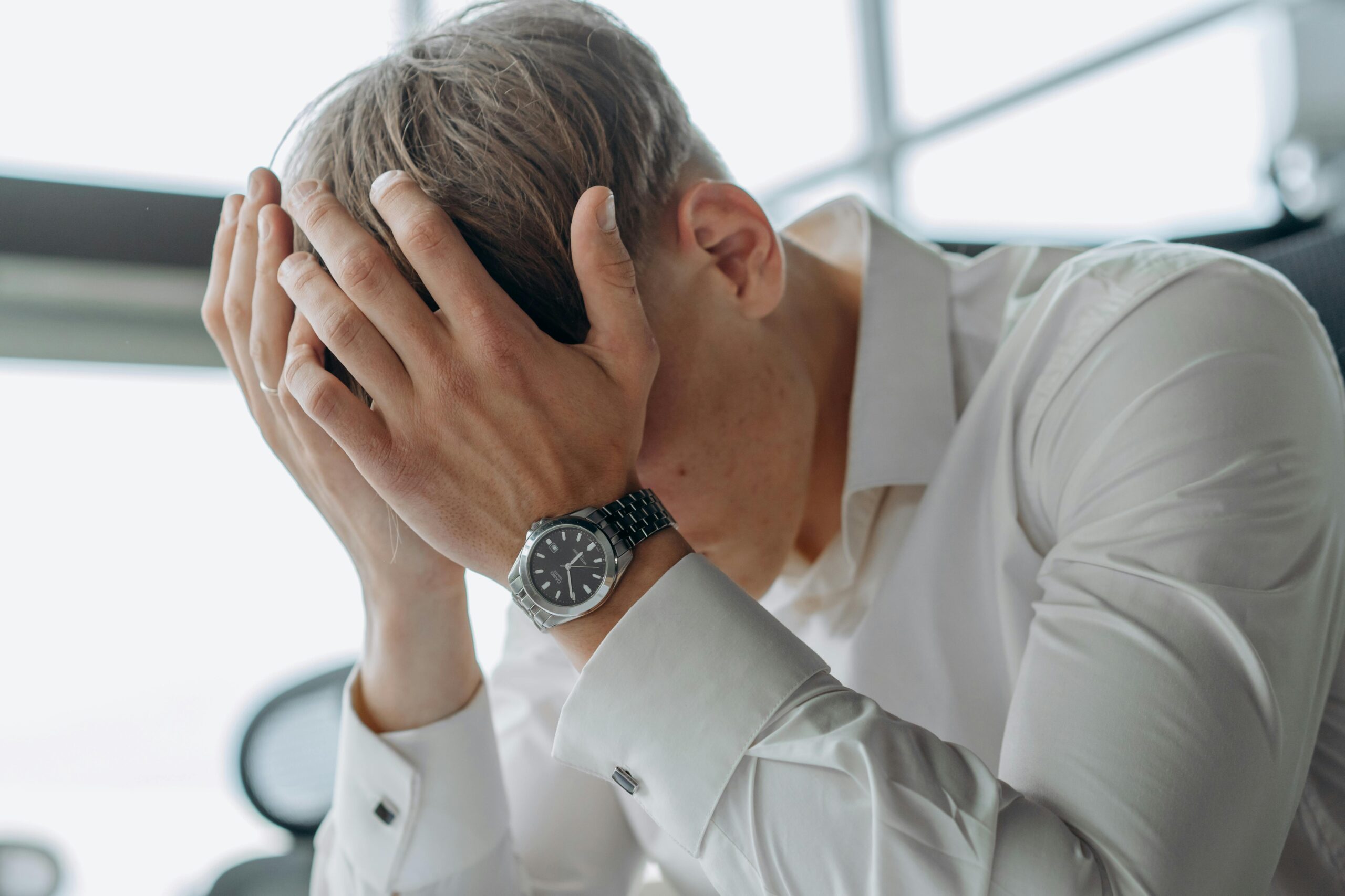 Man resting his head on his hands