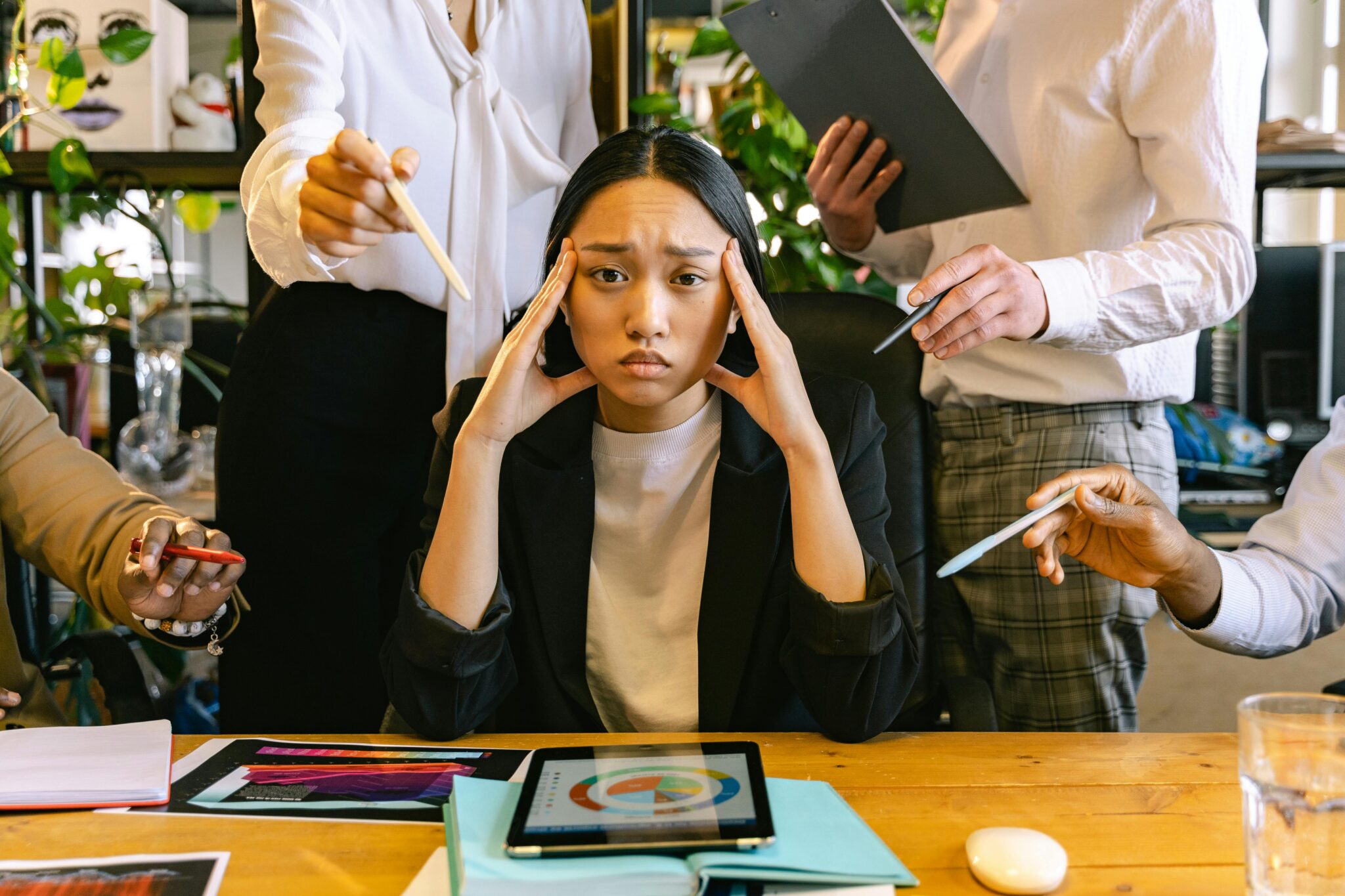 Woman distracted by other people in the office